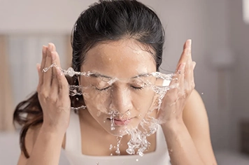 expert skincare tips by a skin specialist on washing care for the face with hot water.